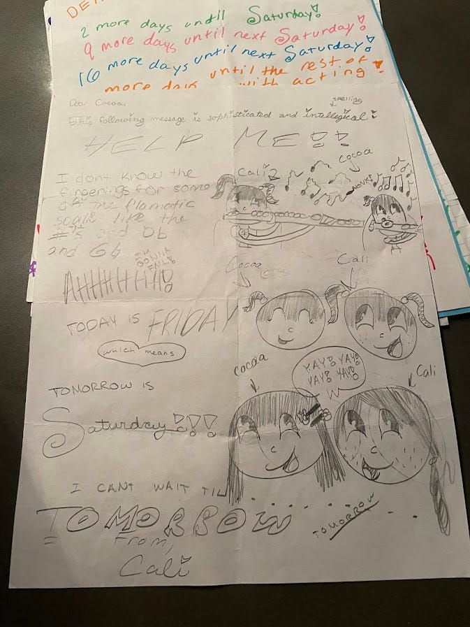 author and her niece pose for a picture together; handwritten note from when the author was 12