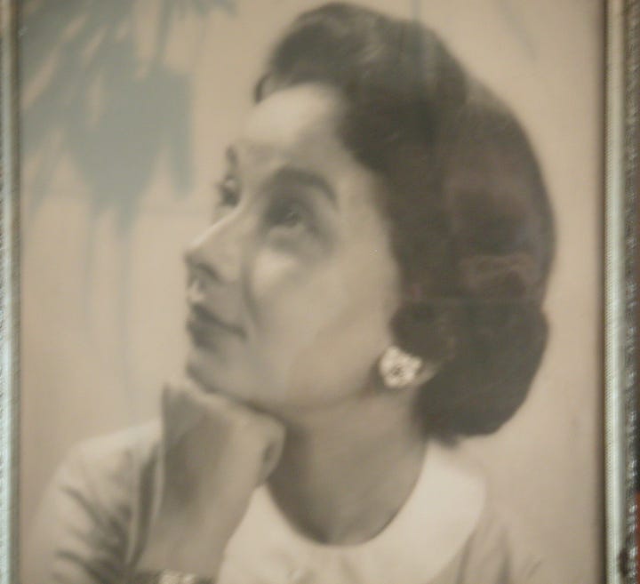 Two images of a sophisticated black-haired woman.