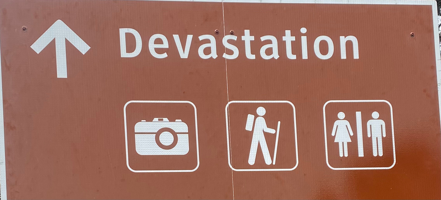 A sign pointing to "Devastation" ahead also advertises and bathrooms.
