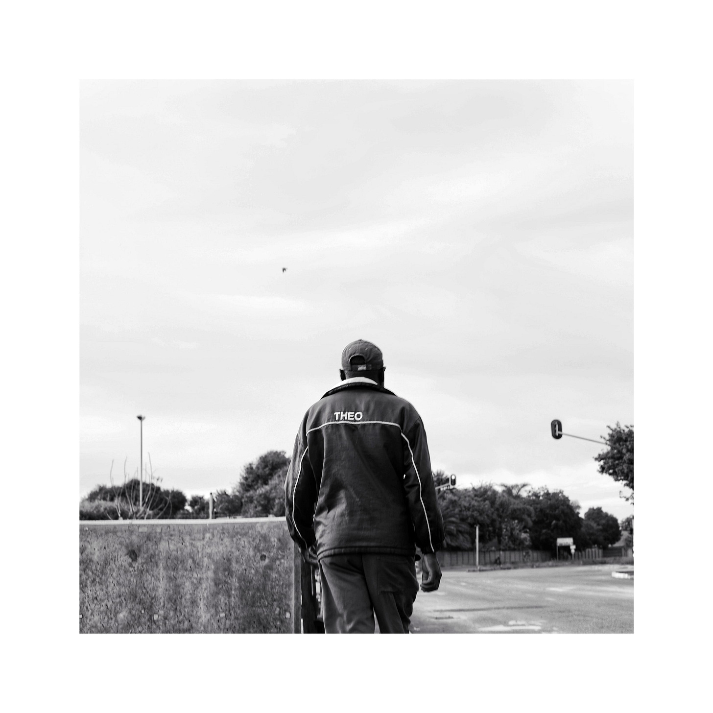 Man with a jacket and the word "Theo" on the back.