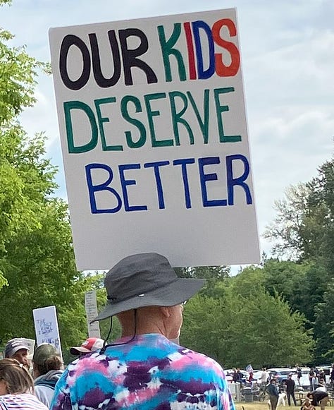 Signs at Bothell No Kings Rally