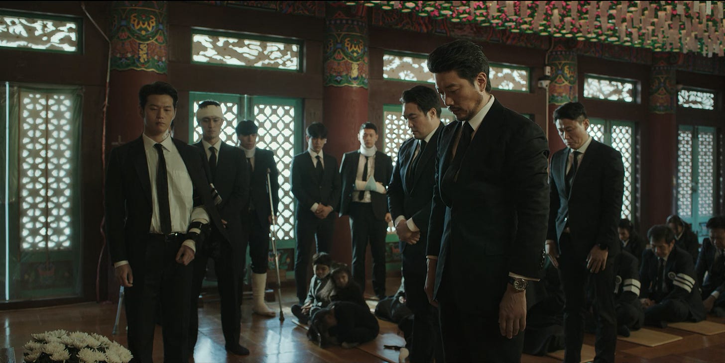 Choi Mu-jin with members of Dongcheon at the temple, attending a funeral, episode four of My Name (2021)