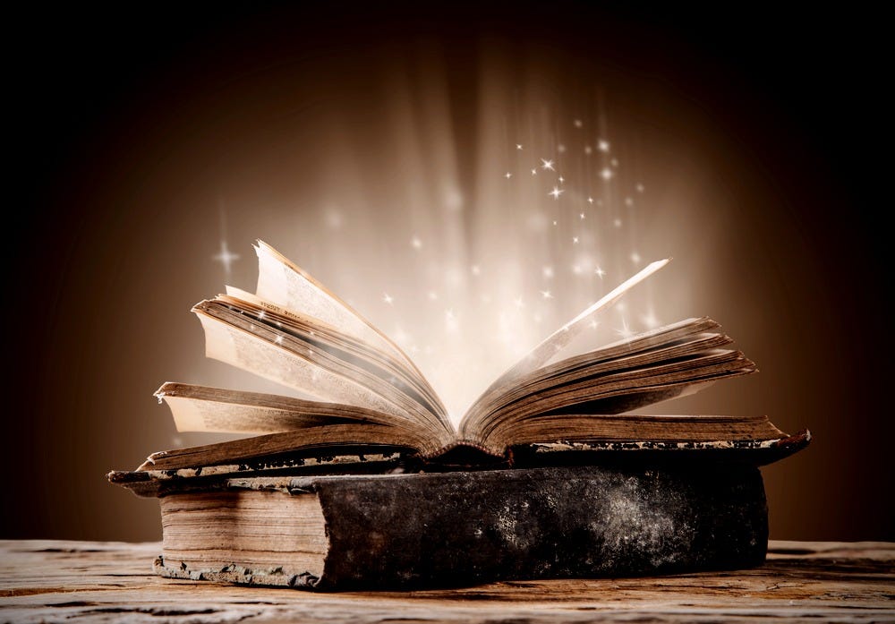 Antique book with light shining out from its pages Antique book with light shining out from its pages