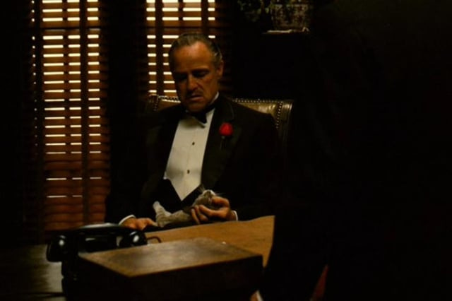 r/MovieDetails - The cat in Brando’s lap in this scene from The Godfather was a stray and improvised. Coppola found it wandering around the studio and put it on Brando’s lap just before he called “action”.