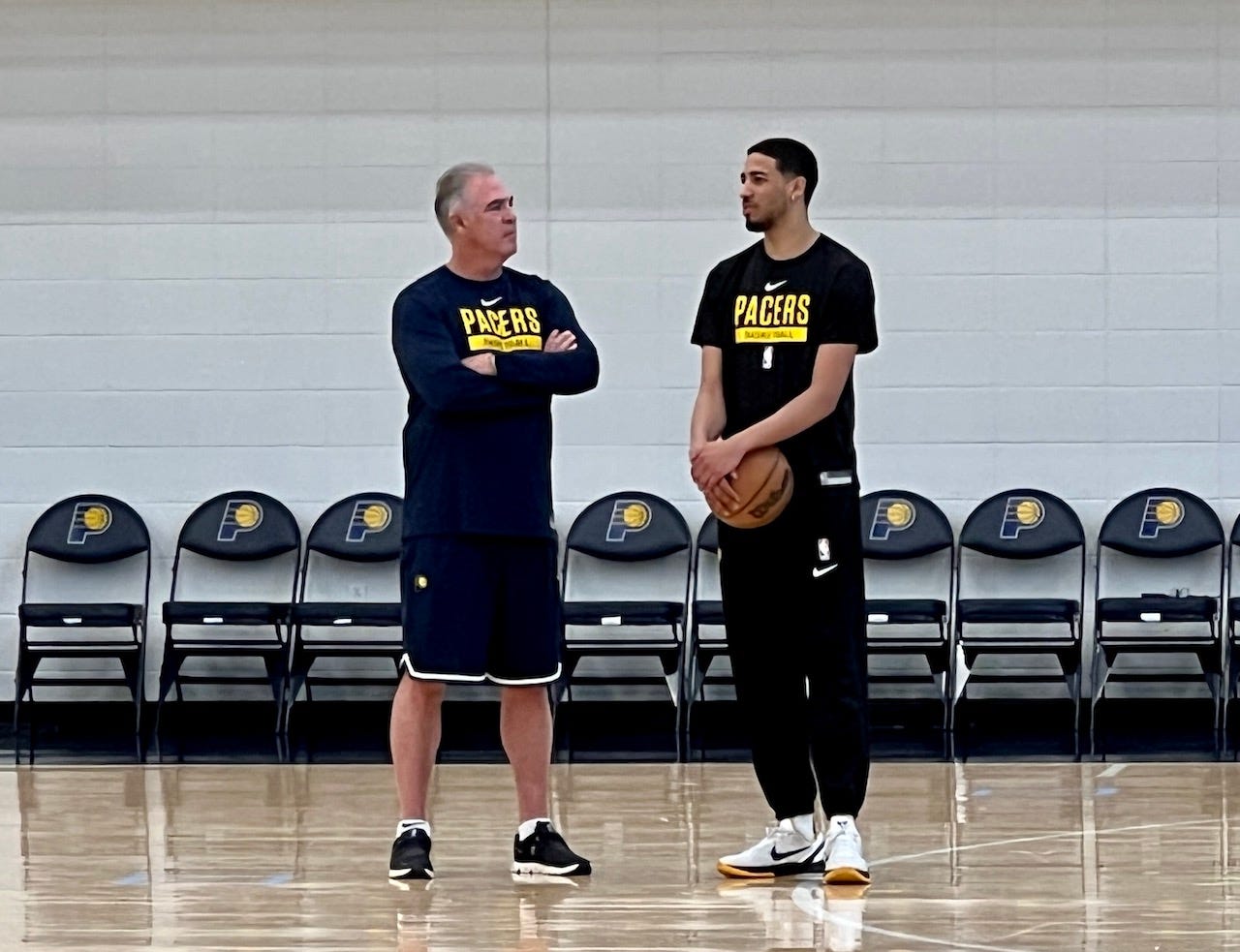 Team president Kevin Pritchard talks with Tyrese Haliburton.
