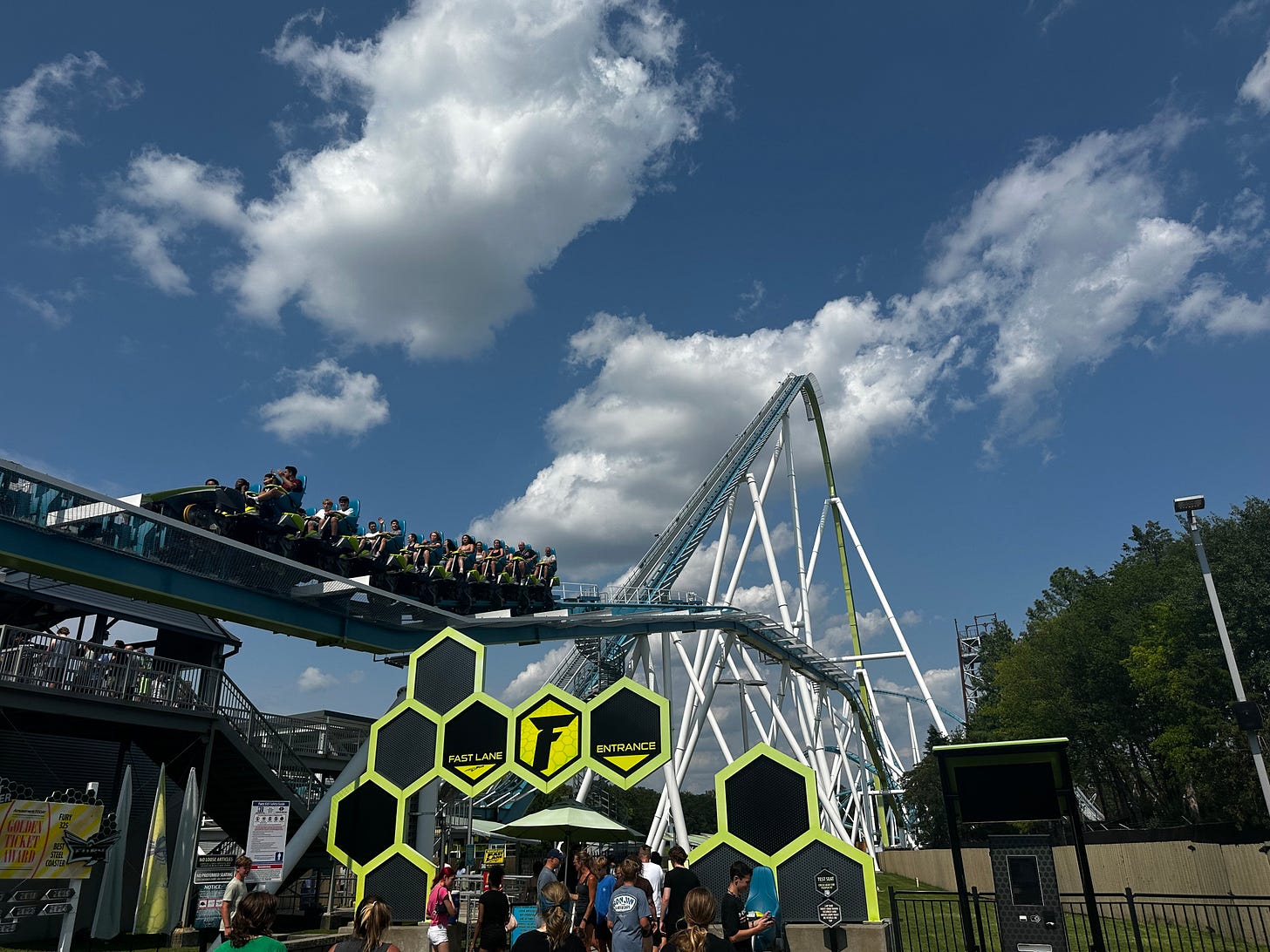 A coaster rises into the blue sky