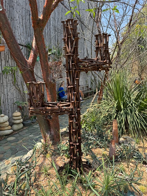 Nine images of sculpture placed within the cactus garden Vives Verde.