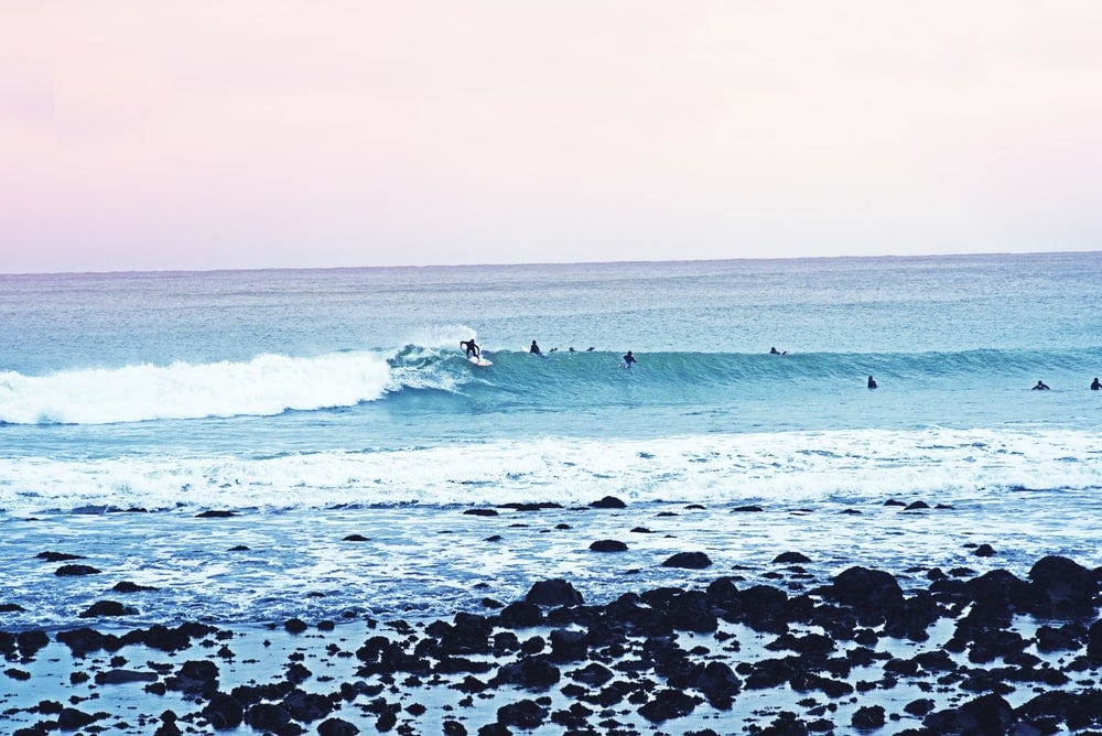 people surfboarding during daytime people surfboarding during daytime