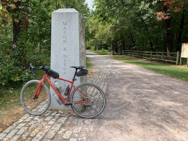 A bicycle leaning against a stone monument

AI-generated content may be incorrect.