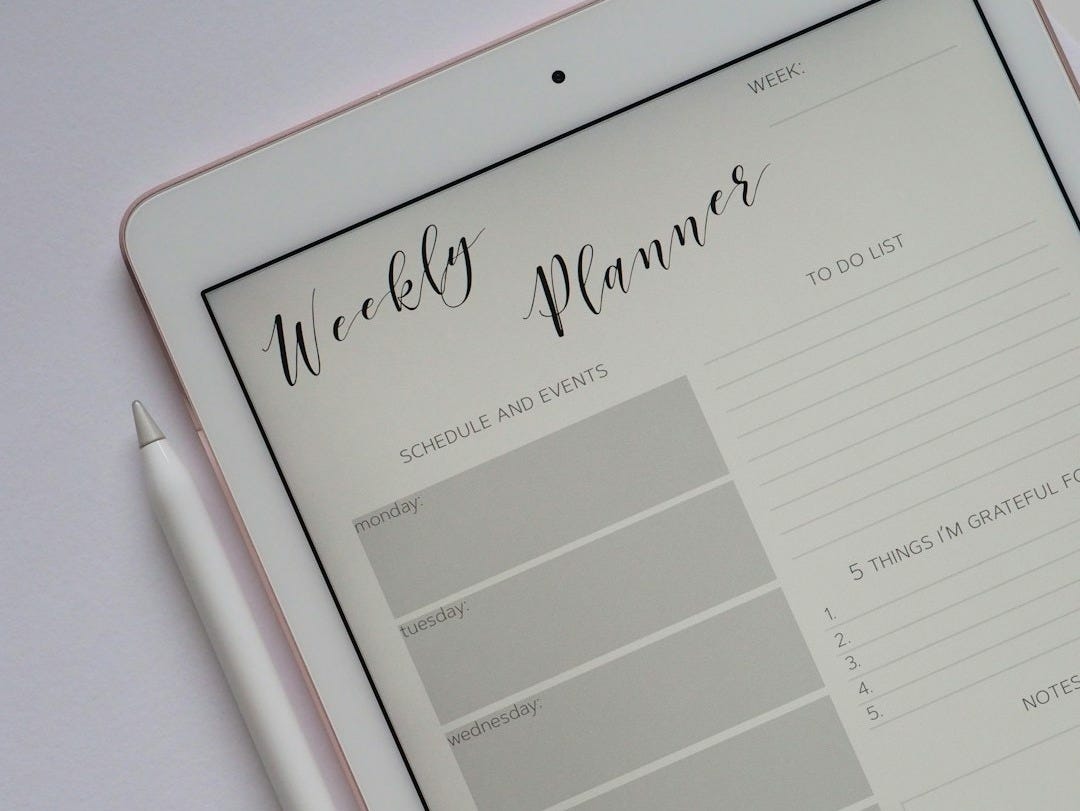 flat lay photography of turned-on silver iPad beside Apple Pencil flat lay photography of turned-on silver iPad beside Apple Pencil