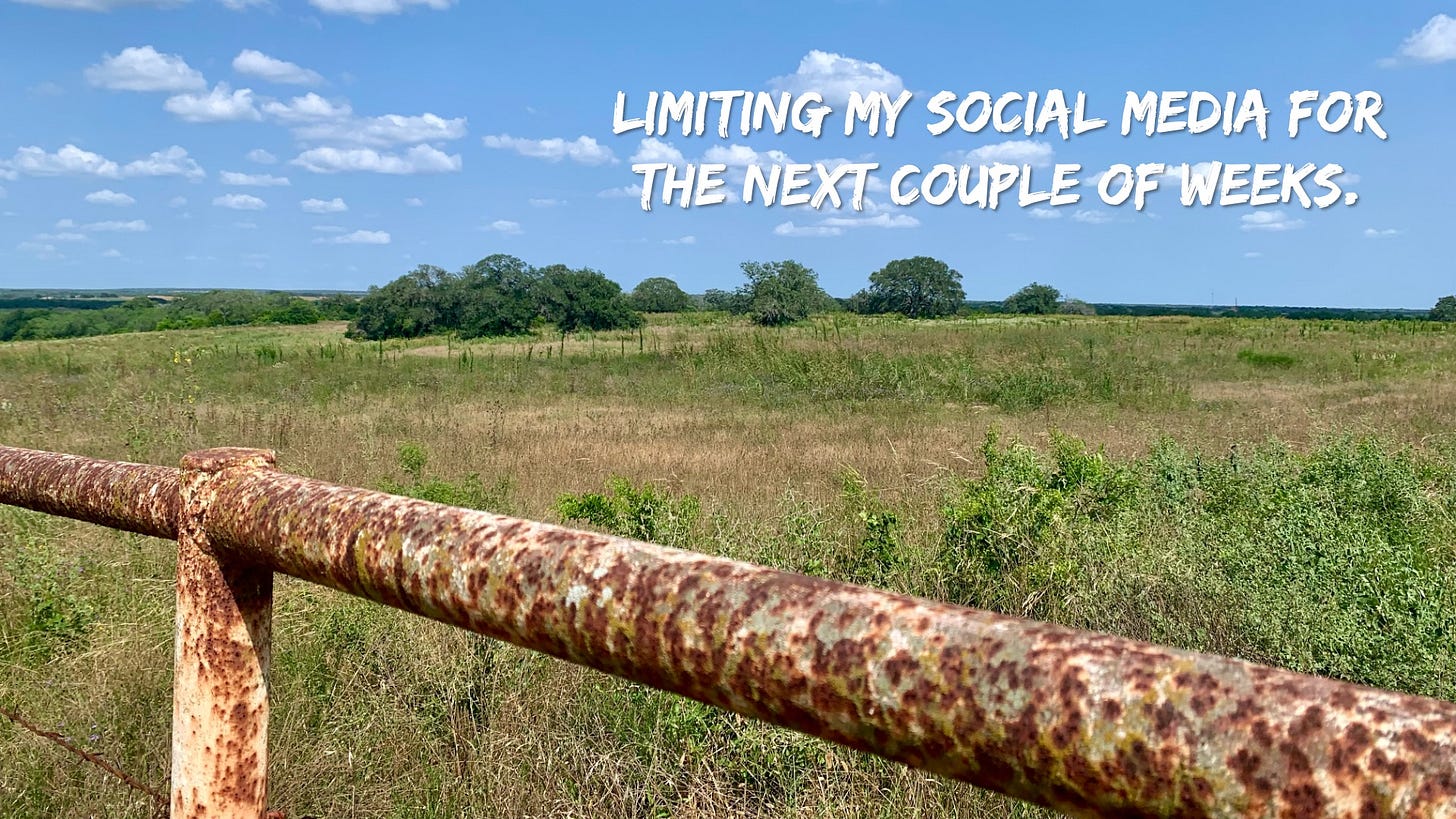 Image of an iron fence and a field with a blue sky behind and the phrase “Limiting my Social Media for the next couple of weeks” superimposed.