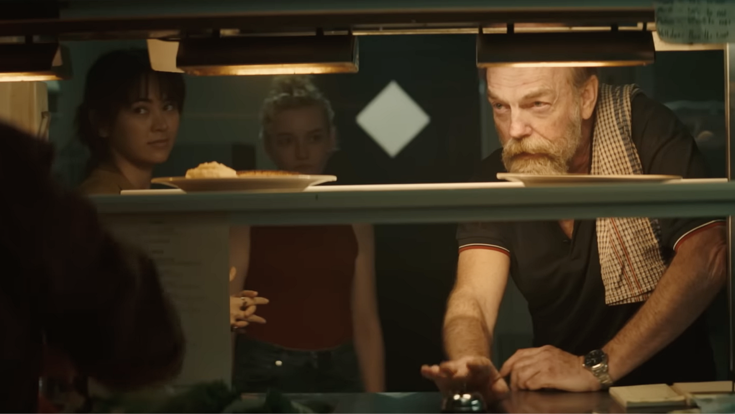 Hugo Weaving, Julia Garner, and Jessica Henwick in The Royal Hotel