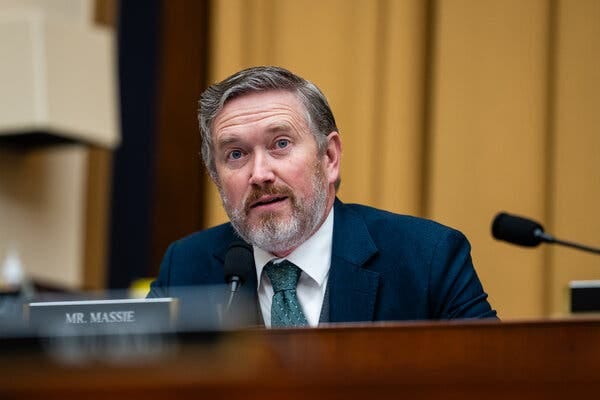 Representative Thomas Massie of Kentucky, wearing a green tie and blue jacket, speaking in a hearing room. Representative Thomas Massie of Kentucky, wearing a green tie and blue jacket, speaking in a hearing room.