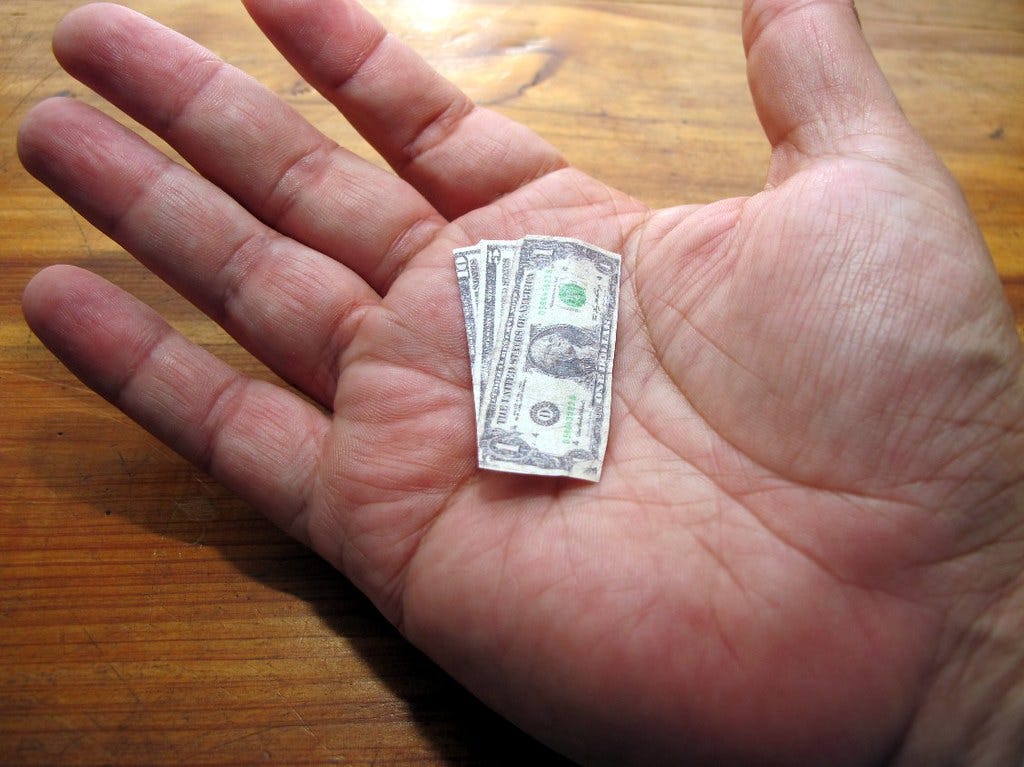 "the shrinking dollar" by frankieleon is licensed under CC BY 2.0.