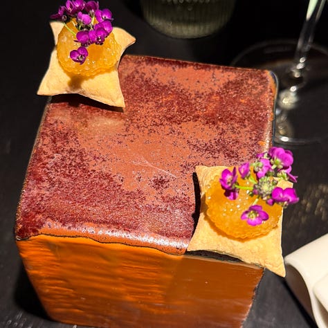 Amuses bouches including poached oysters, puffed bread and goat cheese tartelette at Virtus restaurant, Paris