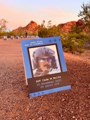 Two women, mothers of fallen soldiers, stand side-by side, holding American flags that represent their fallen sons. An image gallery from that morning shows pictures of fallen soldiers, runners along the Papago Park trail and a beautiful desert morning.