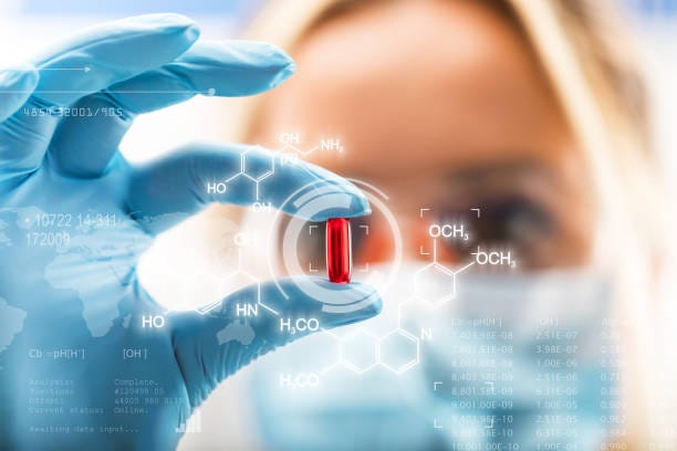 Young attractive female scientist holding a red transparent pill Young attractive female scientist holding a red transparent pill with futuristic scientific air interface with chemical formulas and research data in the foreground drug manufacturing factory stock pictures, royalty-free photos & images