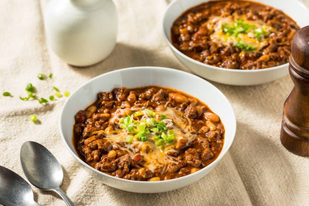 Organic Homemade Turkey Chili Con Carne Organic Homemade Turkey Chili Con Carne with Cheese and Green Onions turkey chilli stock pictures, royalty-free photos & images