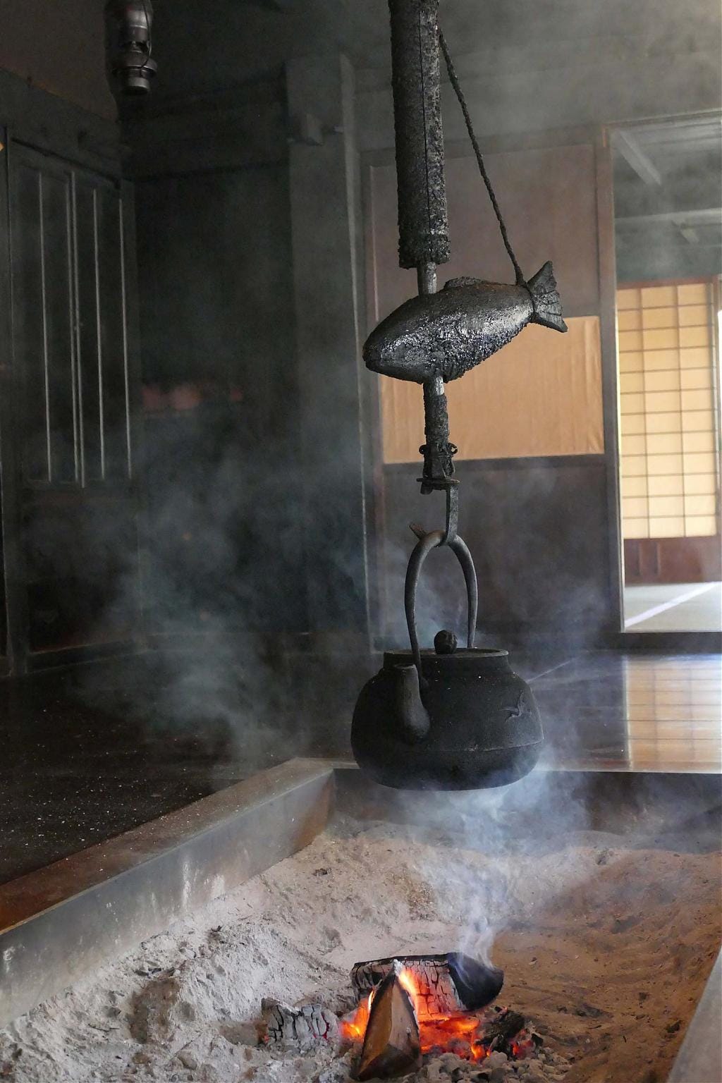 Boiling water above an irori Boiling water above an irori