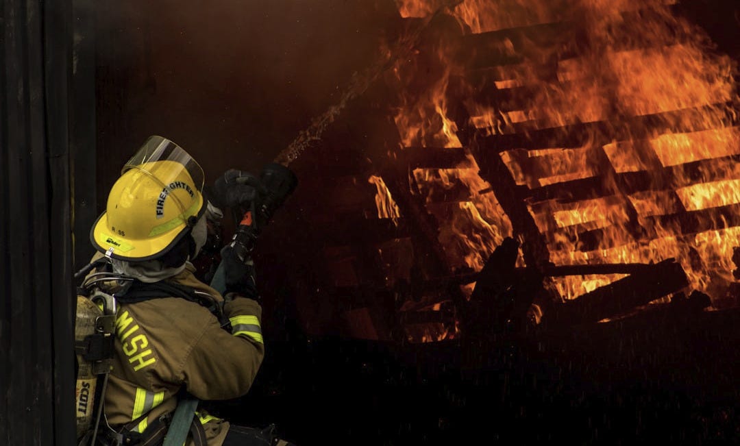 firefighter inside burning house