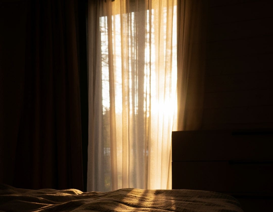 the sun is shining through the curtains on a bed