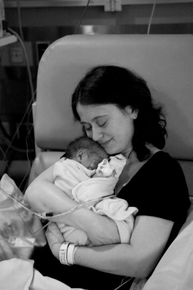 Mom holding baby in NICU Mom holding baby in NICU