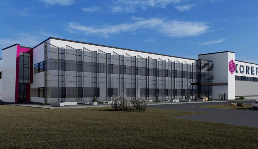 parking lot, blue sky and sleek, rectangular building