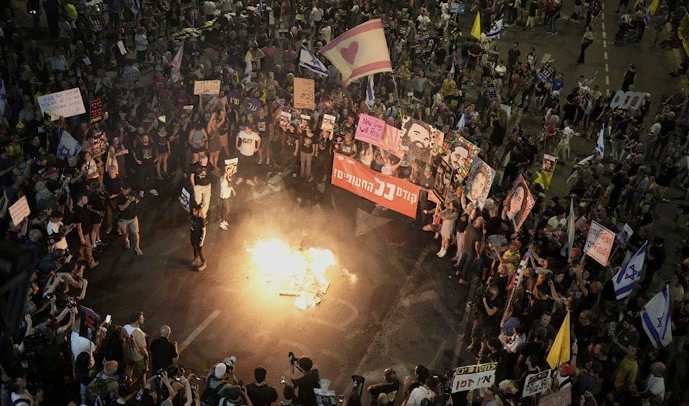 People take part in a protest demanding the end of the war and immediate release of captives, and and against Prime Minister Benjamin Netanyahu's government in Tel Aviv, occupied Palestine, May 17, 2025. (AP)
