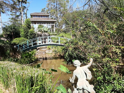 Scenes from the gardens and yard of the Houmas House including a pond sculpture of a crane, the pillars of the front porch with a peacock, and large old live oak trees.