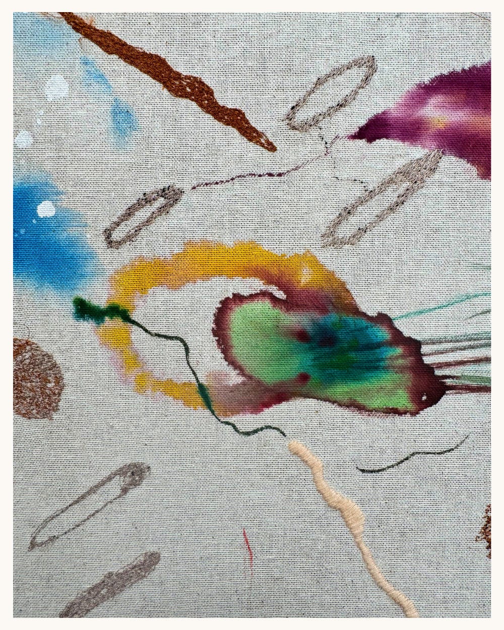 Close detail of Valero’s 2024 piece showing stitched forms and soft watercolor in teal, plum, yellow, and brown on natural fabric.