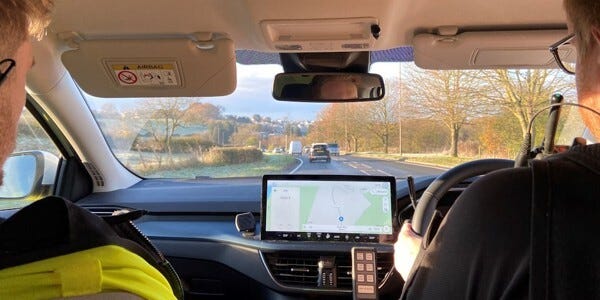 Two officers in a response car on their way to an incident. View looking out of the windscreen.