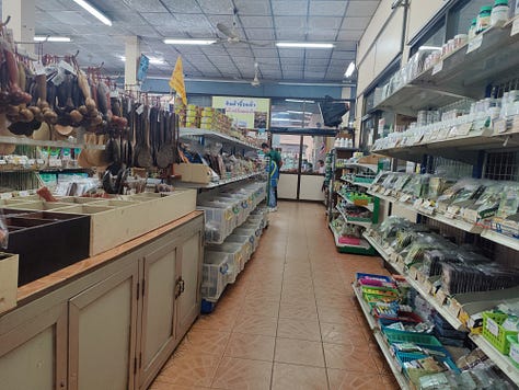 inside the Chamlong's food hall, inside the attached vegetarian store, outside the building