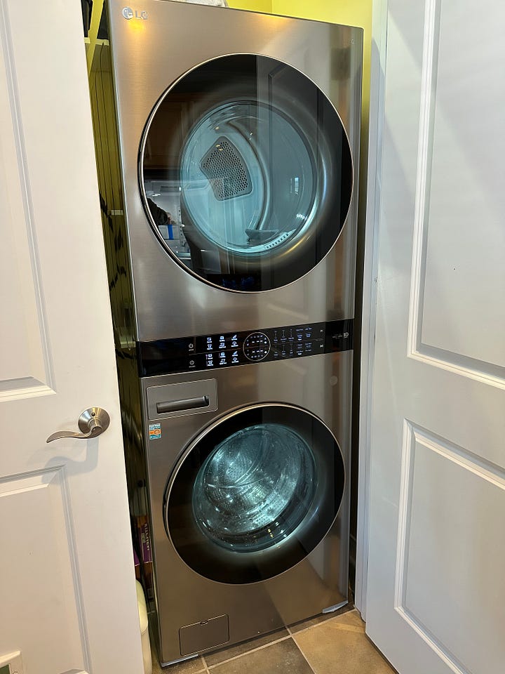 Refrigerator on the left, washer/dryer on the right