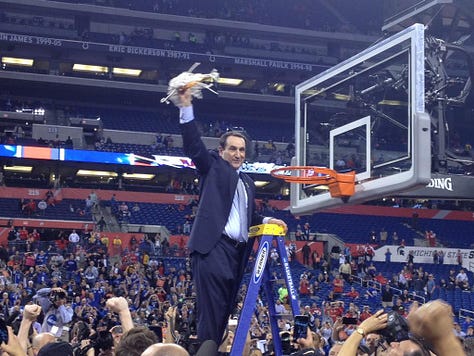 Coach K cutting the nets