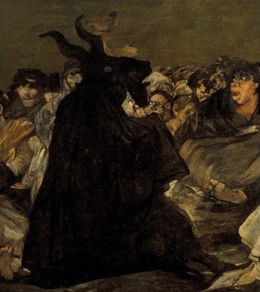 A huge black goat looming over a crowd of witches