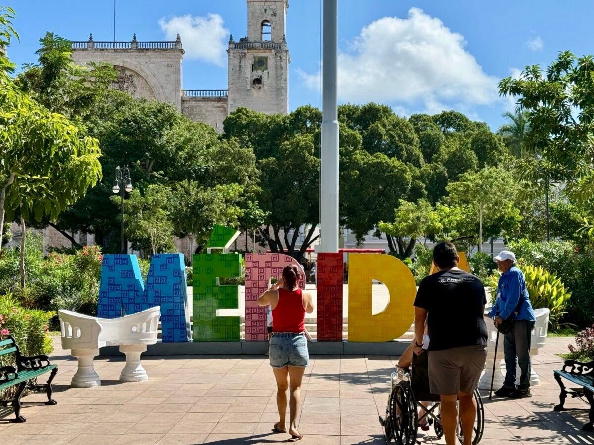 Merida letters at Plaza Grande with people taking photos in Merida MExico 