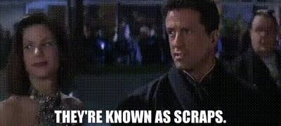 A meme from the 1993 film Demolition Man shows Sylvester Stallone and Sandra Bullock, dressed in formal wear and looking off to the side. The caption reads "They're called Scraps", a reference to the permanent underclass depicted in the film.
