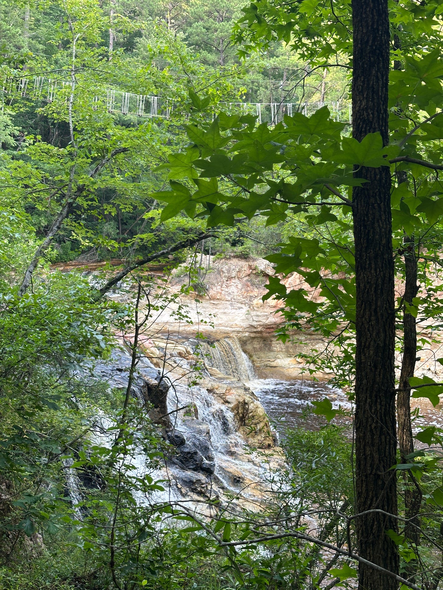 Wide shot of Carver's Falls with bridge above.