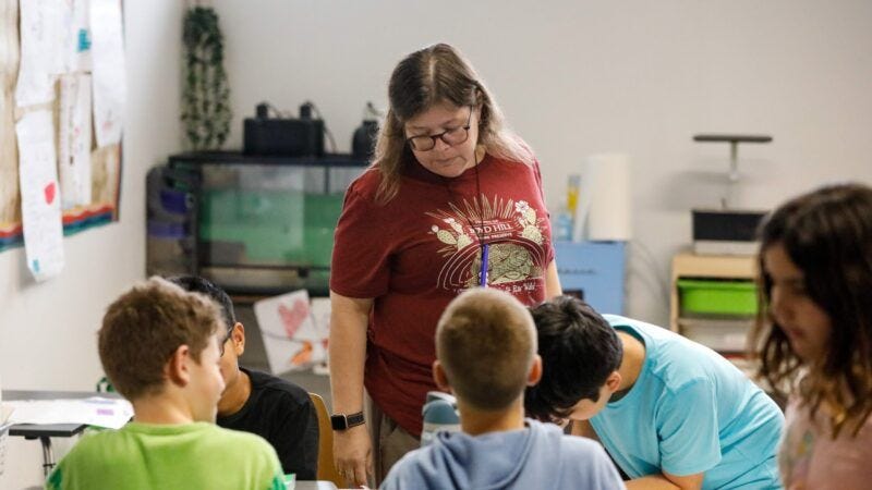 Teacher and students in a school | Jefferee Woo/ZUMA Press/Newscom Teacher and students in a school | Jefferee Woo/ZUMA Press/Newscom