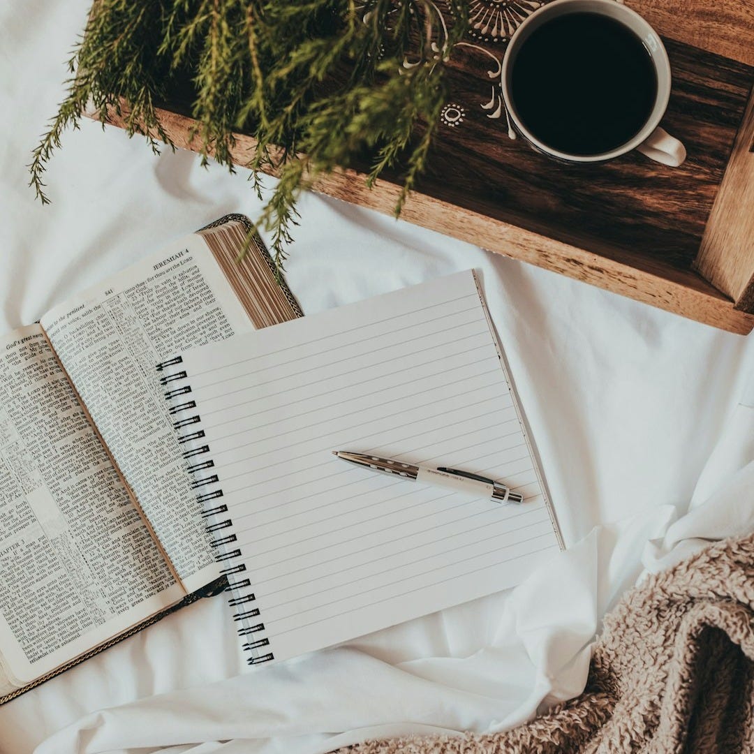 white notebook on white textile white notebook on white textile
