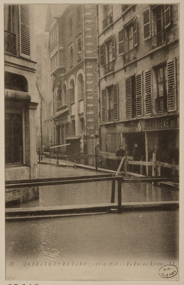 The photo on the left shows the flooded island in 1910 while the photo on the right shows the green marker that indicated the maximum height the floodwaters reached.