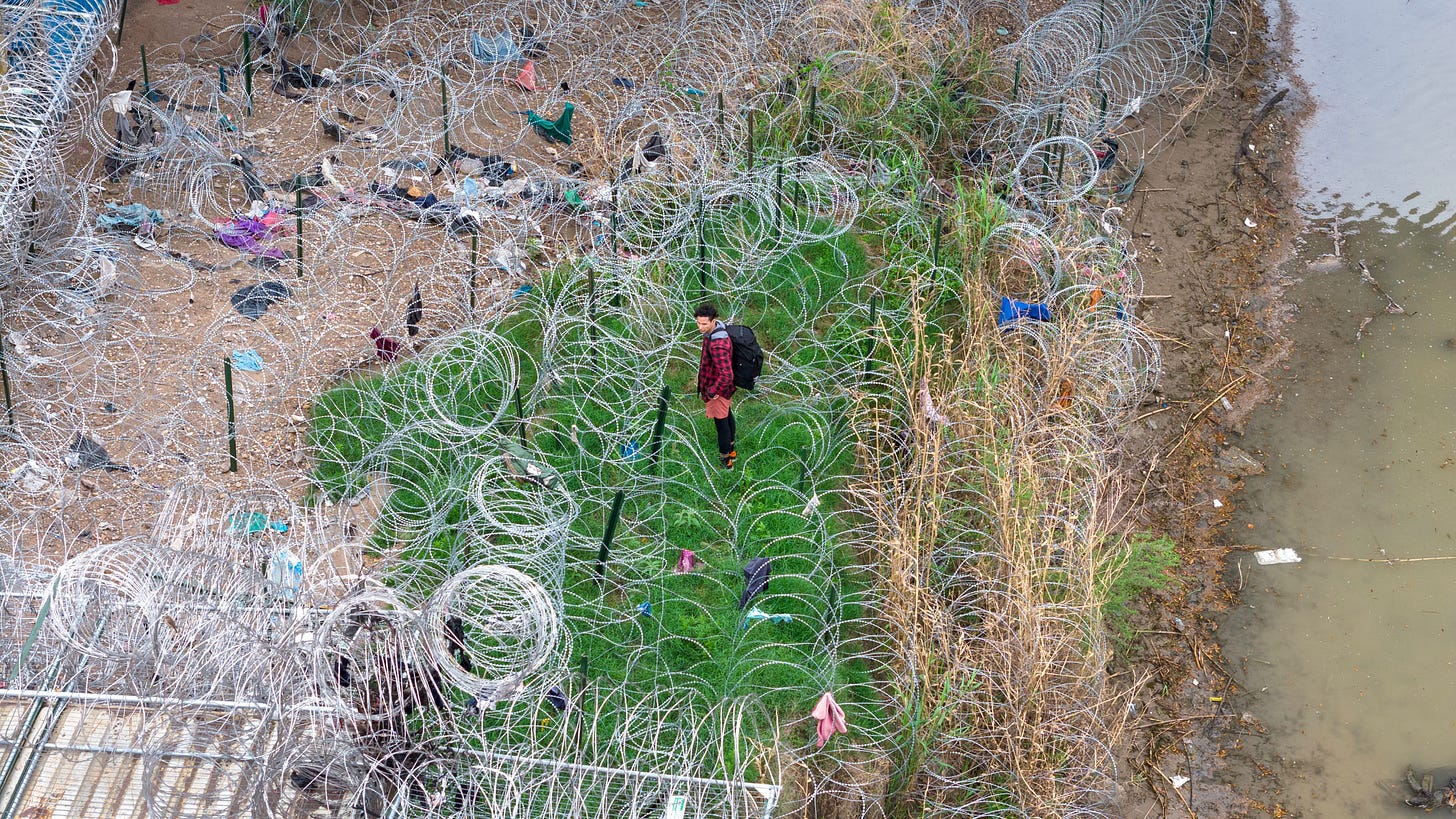 An immigrant faces coils of razor wire after crossing the Rio Grande from Mexico in Eagle Pass, Texas, on March 17. John Moore—Getty Images An immigrant faces coils of razor wire after crossing the Rio Grande from Mexico in Eagle Pass, Texas, on March 17. John Moore—Getty Images