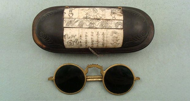(L) Snow goggles were traditionally made of driftwood, bone, walrus ivory, caribou antler, or in some cases seashore grass. (R) smoky quartz glasses