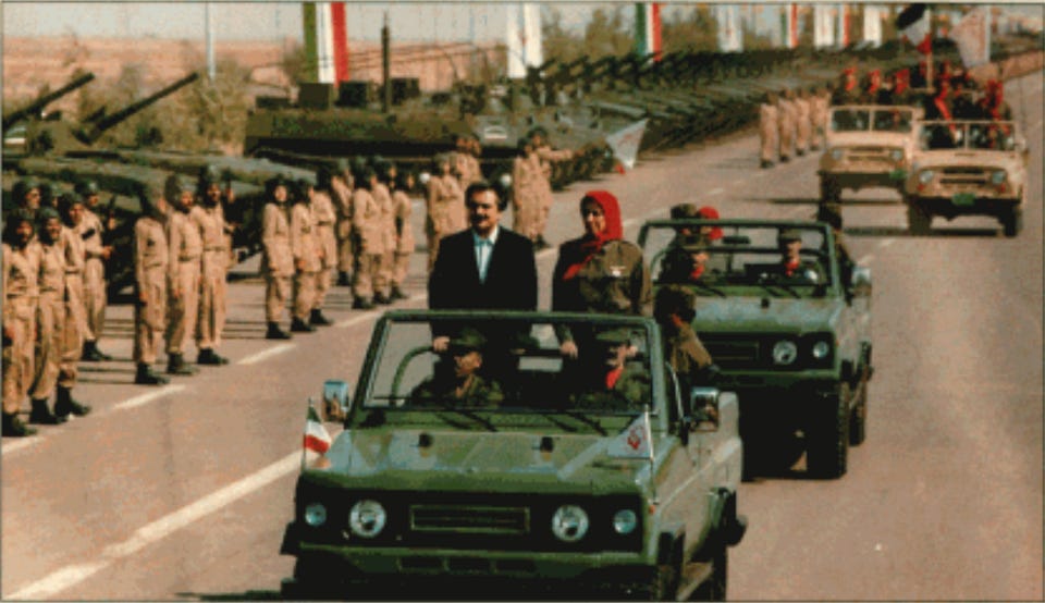 File:Rajavis marching with PMOI soldiers (2).png