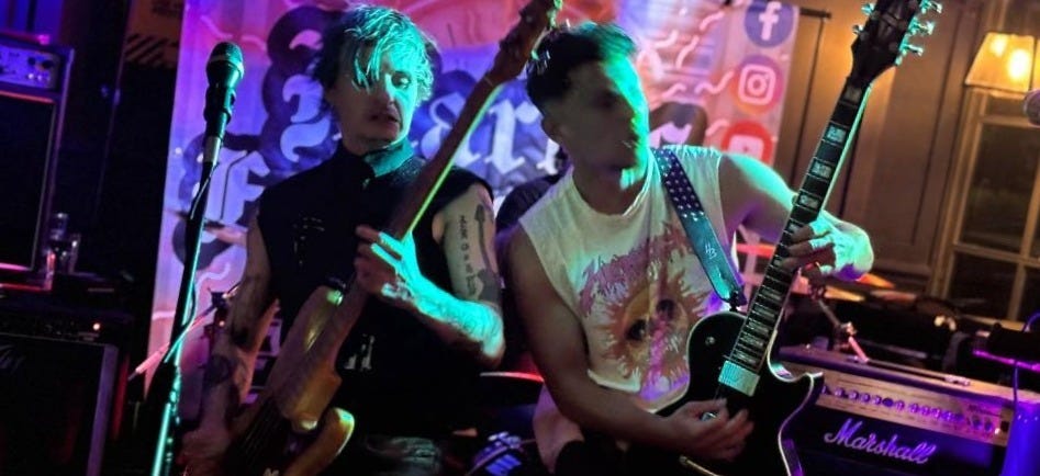 May be an image of guitar and text