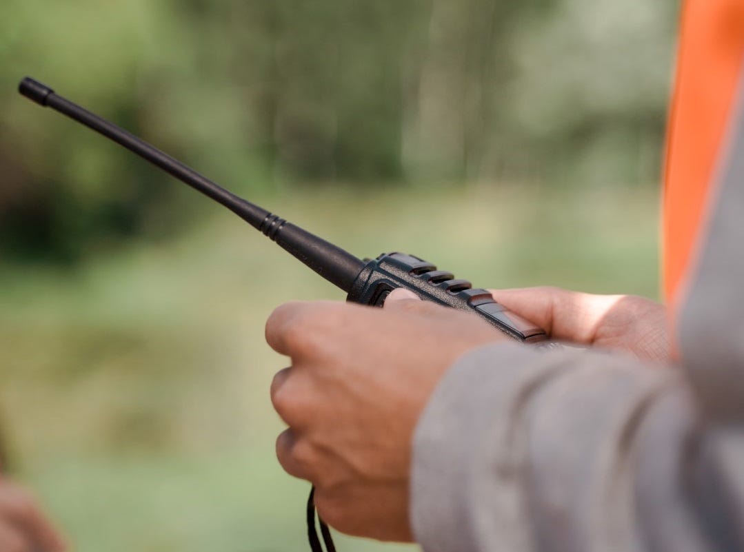 Photo by Ron Lach: https://www.pexels.com/photo/a-shot-of-walkie-talkie-in-hand-10349990/