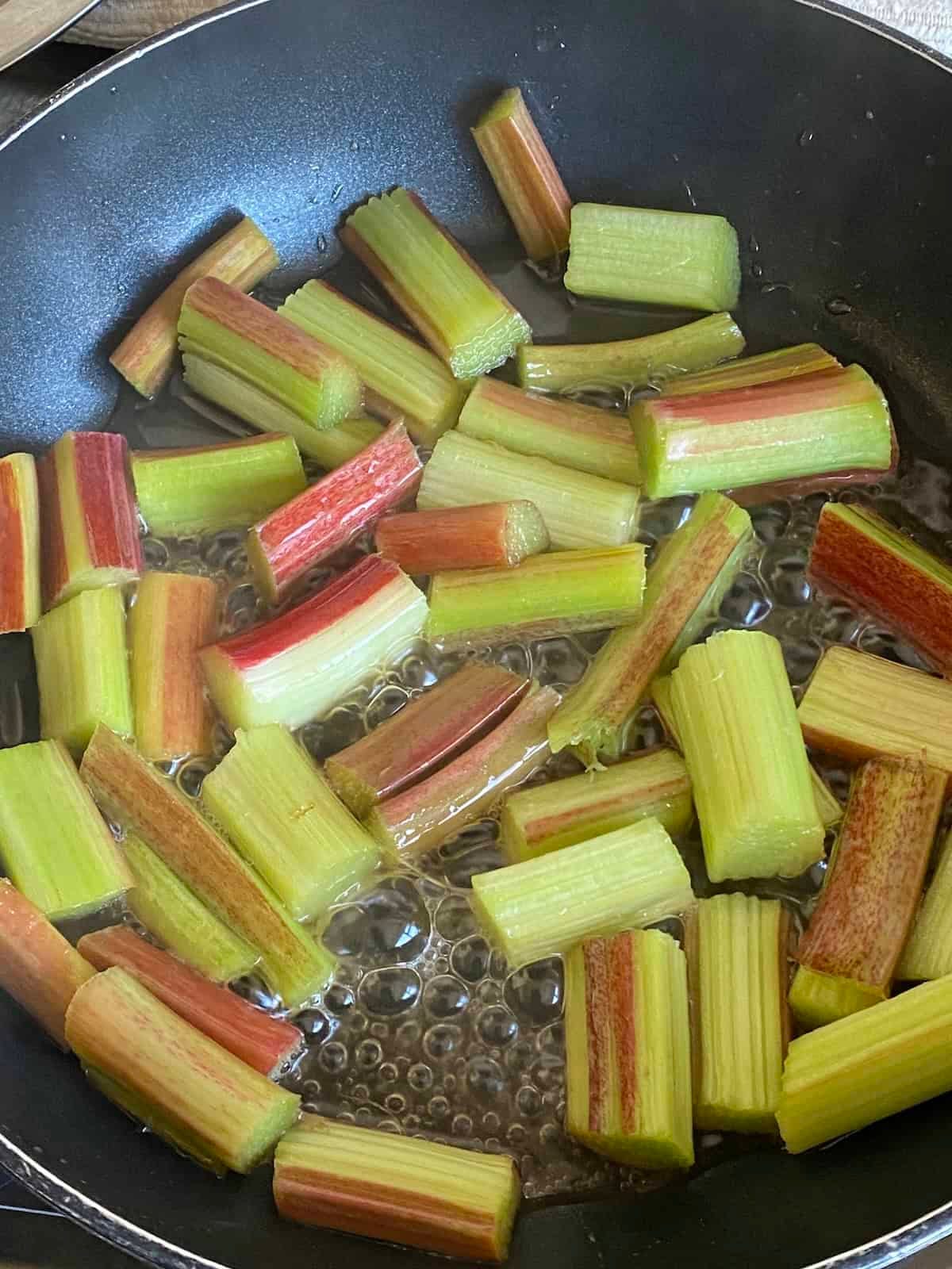 Rhubarb simmering in a pan. Rhubarb simmering in a pan.