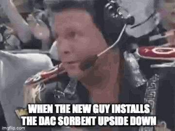 Animated. A wrestling commentator in a headset laughs helplessly, captioned "When the new guy installs the DAC sorbent upside down".