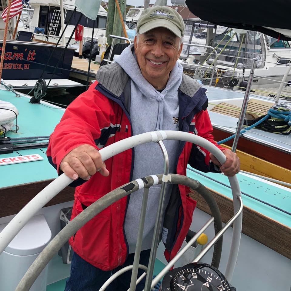 The business coach standing behind the helm of a sailing boat The business coach standing behind the helm of a sailing boat