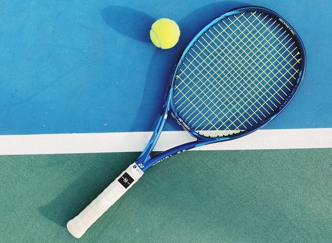 white and blue tennis racket white and blue tennis racket